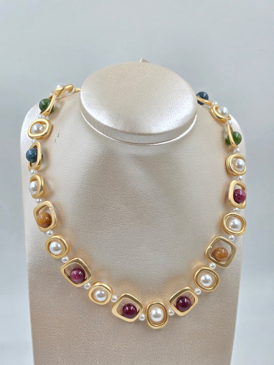 N - Necklace with gold, red, and white stones
