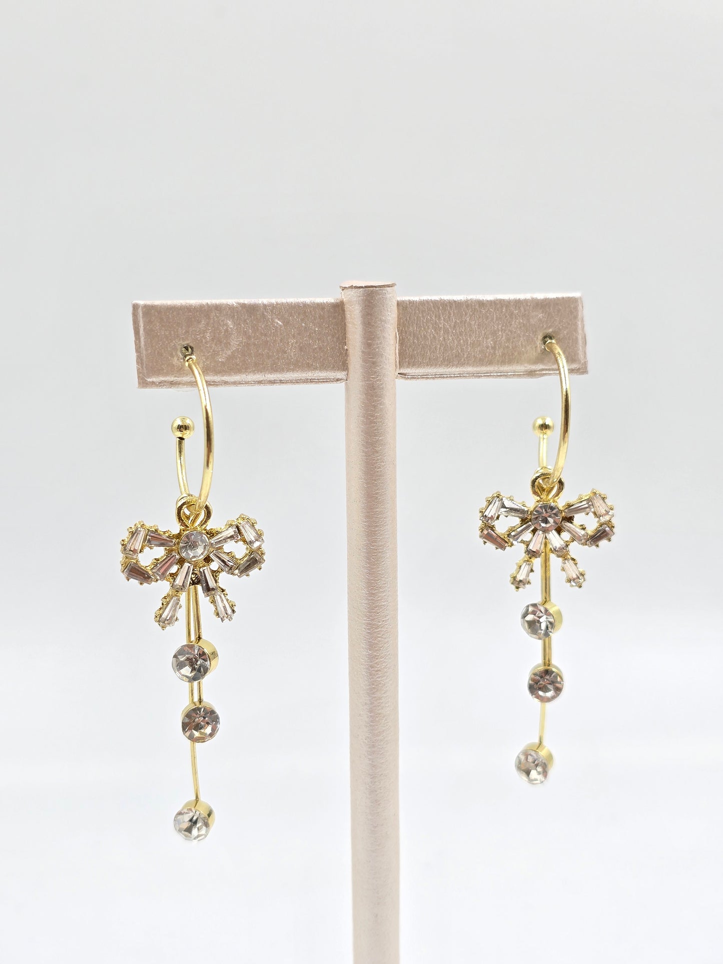 N - Gold Hoop Earrings with Dangling Bow-Shaped Crystal