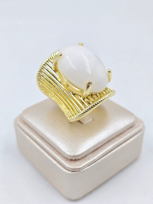 O - Gold ring with large oval white stone